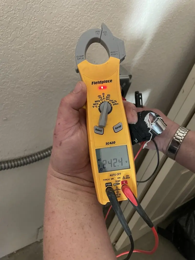 Voltage testing with clamp meter during Electrical Installation Services in Worthington
